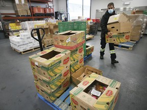 Mohamed Chreif, a volunteer from the Windsor Unemployment Assistance Center is shown in the organization's food bank area on Friday, October 29, 2021.