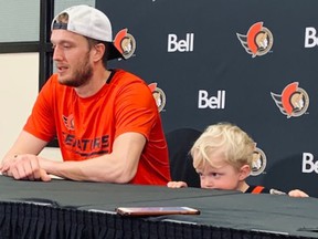 As his son, Ben, steals the scene, Senators goalkeeper Anton Forsberg speaks to the media following his team's 4-0 win over the Lightning on Saturday.