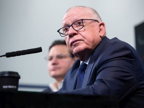 New Vancouver Canucks president of hockey operations and acting general manager Jim Rutherford arrives for his first press conference since being hired by the NHL hockey team in Vancouver on Monday, December 13, 2021.