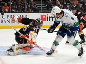 Anaheim Ducks goalkeeper John Gibson (36) blocks a shot from Vancouver Canucks right wing Conor Garland (8) in the second period of the game at the Honda Center.
