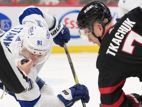 Senators captain Brady Tkachuk has his eyes on the puck as he faces Steven Stamkos of the Lightning in the second period of Saturday's game.  Tkachuk also found time to produce his first NHL hat trick in Ottawa's 4-0 win.