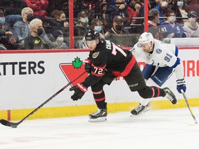 Senators defender Thomas Chabot (72) skates the puck in front of Lightning center Steven Stamkos (91) in the first period Saturday afternoon.