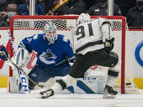 Vancouver Canucks goalkeeper Thatcher Demko (35) saves Los Angeles Kings forward Carl Grundstrom (91) in the third period at Rogers Arena in early December.  Vancouver won 4-0.