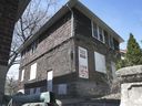 A bricked-up house at 357-359 Indian Road in Windsor is displayed on Friday, April 9, 2021. The building's new owners are petitioning the city to demolish it and replace it with a new building designed to resemble the house.  in 1958.