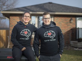 Jessica Gaudette, left, and Chris Elliott, co-founders of Kind Mind, are pictured in front of the newly purchased home they purchased to use as a supportive home for adults with disabilities, Thursday, Dec. 23, 2021.