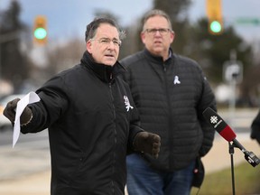 Windsor West MP Brian Masse, left, speaks during a press conference in front of the Stellantis Windsor Assembly Plant with Unifor Local 444 President Dave Cassidy on Monday, Dec. 6, 2021.