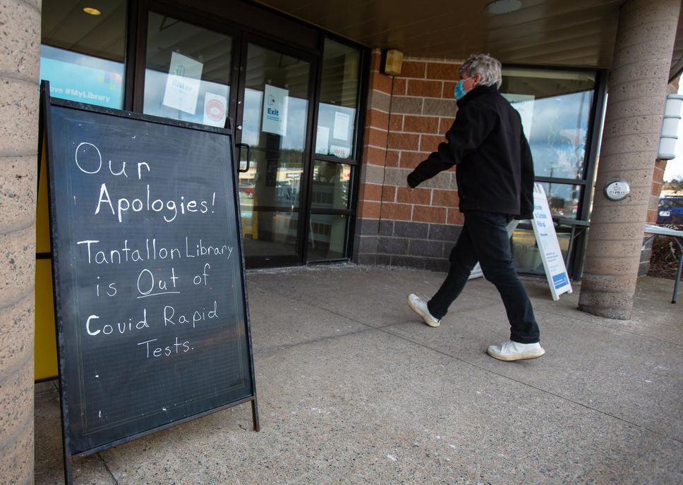 A man enters the Tantallon branch of the Halifax Public Library after he ran out of rapid COVID tests in Tantallon, NS, on December 14.