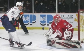 Soo Greyhound goalkeeper Tucker Tynan stops Christopher O'Flaherty on Thursday, December 16, 2021 at the WFCU Center in Windsor.