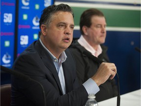 The Vancouver Canucks apparently fired head coach Travis Green (left).