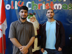 Brothers Delawar Pasoon, left, and Khan Samindar worked as interpreters for the Canadian Armed Forces in Afghanistan.  Pasoon recently moved to Canada and spent his first Christmas in Surrey with his wife and two-year-old daughter.