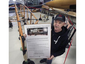 Don Christopher, president of the Canadian Museum of Aviation in Windsor is displayed alongside the Silver Dart project on Wednesday, December 22, 2021. A group of aviation enthusiasts is building a replica of the primitive aircraft.