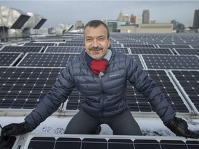 Pictured between rows of solar panels on the roof of the Windsor International Aquatics and Training Center, Sokol Aliko, manager of Energy Initiatives in the City of Windsor, is pictured on Wednesday, Dec. 8, 2021.