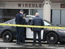 OPP officers and fire investigators gather at Wineology at Green Valley Plaza in Tecumseh after a fire on March 2, 2020. The Ontario Fire Marshal's office has determined that the incident was a case of arson. .