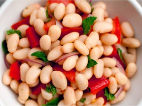 White beans are paired with tomatoes, red bell pepper, and red onion in this Macedonian recipe: The Cookbook by Katerina Nitsou.