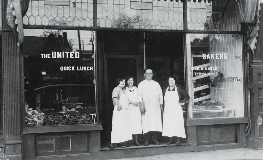 Rosie, left, Rose, Aaron and Sarah Ladovsky in front of United Bakers on Spadina Avenue around 1920.