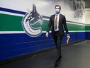 Canucks defender Oliver Ekman-Larsson fulfills the COVID-19 mask mandate as he enters Rogers Arena.