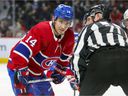 The Canadiens' Nick Suzuki talks with linesman Brad Kovachik during a game this season.  Suzuki heads to Las Vegas next month for the NHL All-Star Game.