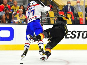 The Canadiens' Alexander Romanov checks out Vegas Golden Knights defenseman Alex Pietrangelo during the 2021 Stanley Cup Semifinals at T-Mobile Arena in Las Vegas on June 14, 2021.