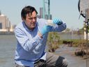 Windsor,Ont.  20th May, 2020. Mike McKay, executive director of the Great Lakes Environmental Research Institute, examines a sample of wastewater from the Detroit River on Wednesday.  McKay and his team at the University of Windsor are studying sewage discharge to monitor for COVID-19.  See history.