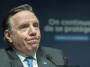 Quebec Prime Minister Francois Legault speaks during a press conference in Montreal, Thursday, December 30, 2021, where he gave an update on the ongoing COVID-19 pandemic in the province.