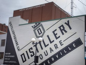On Tuesday, January 11, 2022, a mural of Distillery Square is displayed with the old shelves of the original Walkerville Distillery in the background.