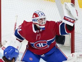Montreal Canadiens goaltender Jake Allen catches the puck as they face the Chicago Blackhawks in Montreal on December 9, 2021.