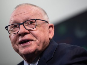 New Vancouver Canucks president of hockey operations and interim general manager Jim Rutherford jokes with a reporter during his first press conference since being hired by the NHL hockey team in Vancouver on Monday, September 13. December 2021.