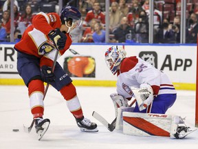 Florida Panthers Mason Marchment (17) passes the puck in front of Canadiens goalkeeper Sam Montembeault during the second period at the FLA Live Arena on Saturday, January 1, 2021 in Sunrise, Florida.