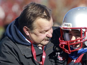 Bob Mironowicz, who died on January 7, 2022, is shown here coaching a player during a Lakeshore Cougars peewee football game in 2010.