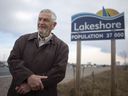 Lakeshore Township Mayor Tom Bain stands next to a Lakeshore sign on County Road 22 on Thursday, December 31, 2020. The Town of Lakeshore is now Lakeshore Township.