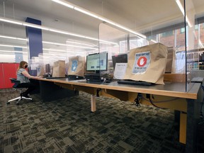 Some computers are covered with paper to promote physical distancing at the Windsor Public Library Central Branch, Saturday, January 15, 2022.