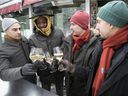 Members of the pop up restaurant Cinquième Vague celebrate as they look at their new outdoor terrace project at Kamúy restaurant on Place des Festival on Wednesday Jan. 19, 2022. From left are: Massimo Piedimonte, Paul Toussaint, Xavier Richard-Paquet and Joris Gutierrez -Garcia.