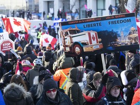 MONTREAL, QUE.: FEBRUARY 5, 2022 -- Demonstrators carried signs on Grande Allee next to the Quebec National Assembly during a massive protest against the COVID-19 vaccine and health restrictions on Saturday, February 5, 2022. (Pierre Obendrauf / MONTREAL GAZETTE) ORG XMIT: 67360 - 1257