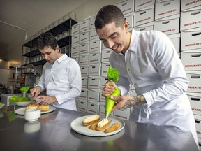 Chefs Francis Blais, left, and Camilo Lapointe-Nascimento prepare French pastries at Menu Extra, one of the Montreal establishments offering special Valentine's menus this year.