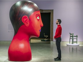 Nicolas Party confronts a piece in his exhibit L'heure mauve.  The show places Party's art alongside works he has chosen from the MMFA's collection.  He has also been given carte blanche to customize the space in which the art is shown.