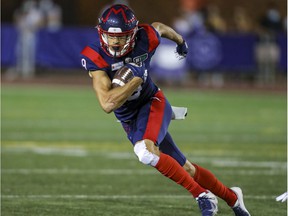 Montreal Alouettes receiver Jake Wieneke heads upfield after catching a pass against the Hamilton Tiger Cats during game in Montreal on Aug. 27, 2021.