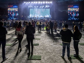 Fans were allocated to "pods" at the Osheaga Get Together, a paired-down version of the music festival, at Parc Jean-Drapeau in Montreal on Oct. 1, 2021. Montreal Mayor Valérie Plante on Sunday, Feb. 6, 2022, said the city needs a reopening plan from Quebec after suffering through the COVID-19 pandemic's fifth wave.