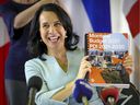 Montreal Mayor Valérie Plante holds up a copy of the city's budget for November 2020. 