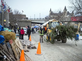 People gathered in Downtown Ottawa during the Freedom Convoy protest, Sunday, Feb. 6, 2022. The group set up in and around Confederation Park peacefully were packing up and leaving the park Sunday morning.