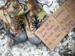 A pair of boots sat in the snow on a Centretown street with a note.