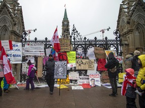 People gathered in Downtown Ottawa during the Freedom Convoy protest, Sunday, Feb. 6, 2022.