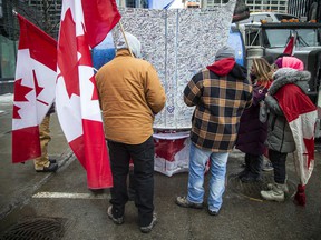 People gathered in Downtown Ottawa during the Freedom Convoy protest, Sunday, Feb. 6, 2022.