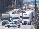 Trucks are shown in the northbound lanes of Huron Church Road on Tuesday, February 8, 2022.