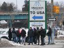 Blockade spreads.  Anti-mandate protesters are shown on Wyandotte Street West near the Ambassador Bridge entrance to the United States on Thursday morning, Feb. 10, 2022. After blocking Huron Church Road, losing this access means no traffic on the bridge.
