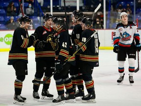 Vancouver Giants players celebrate an early-season goal against the visiting Kelowna Rockets at the Langley Events Centre.  Three of the Giants' five postponed games this season have had the Rockets as their opponents.