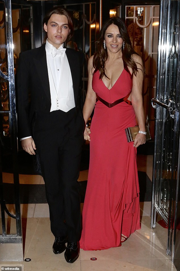 Turning heads on the night in a plunging red Roberto Cavalli number, was Elizabeth Hurley, 56. The actress slinked in with her son, Damian, 19, dressed in traditional white tie and tails