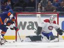 Canadiens goaltender Andrew Hammond stops a scoring chance from Anders Lee of the New York Islanders at UBS Arena on Sunday, Feb. 20, 2022 in Elmont, NY 