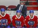 Laval Rocket head coach Joël Bouchard behind the bench during his team's American Hockey League game against the Belleville Senators in Montreal on Feb. 12, 2021.
