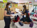Grade 3 teacher and students wear masks in class at a Lester B. Pearson School Board elementary school in the West Island.