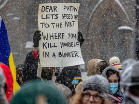 Hundreds rallied at Place du Canada in Montreal on Sunday, Feb. 27, 2022 to protest against the Russian invasion of Ukraine.